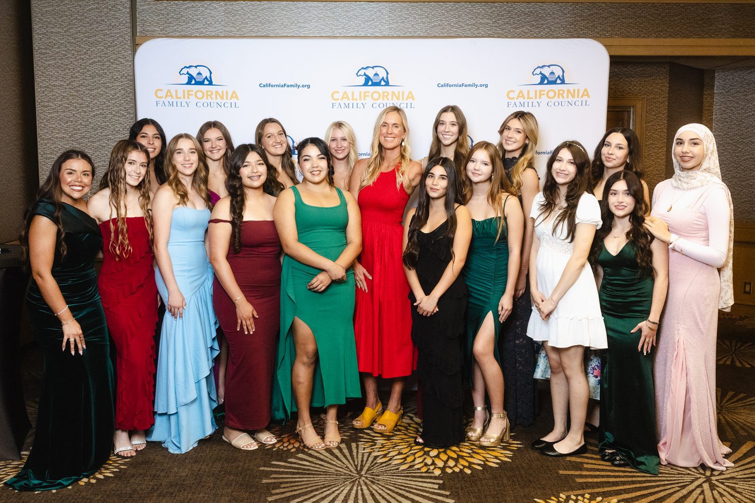 Bethany Hamilton with young women athletes, 2025
